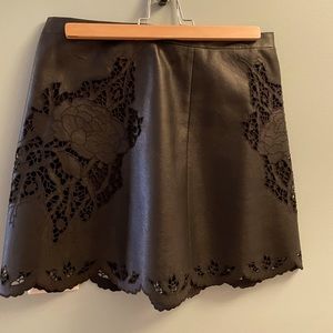 Classy floral black leather mini skirt , scalloped
